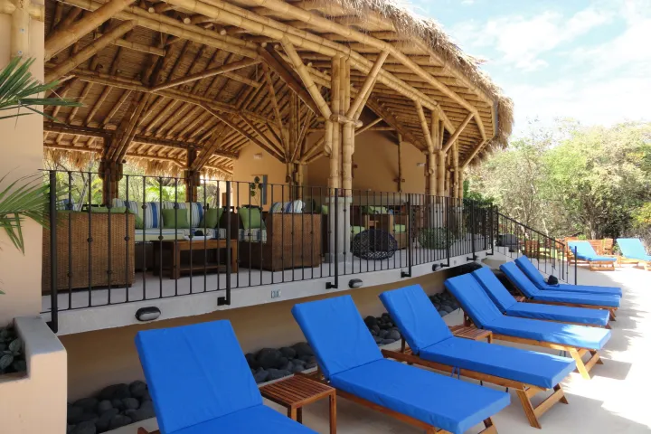 a chair sitting in front of a blue bench