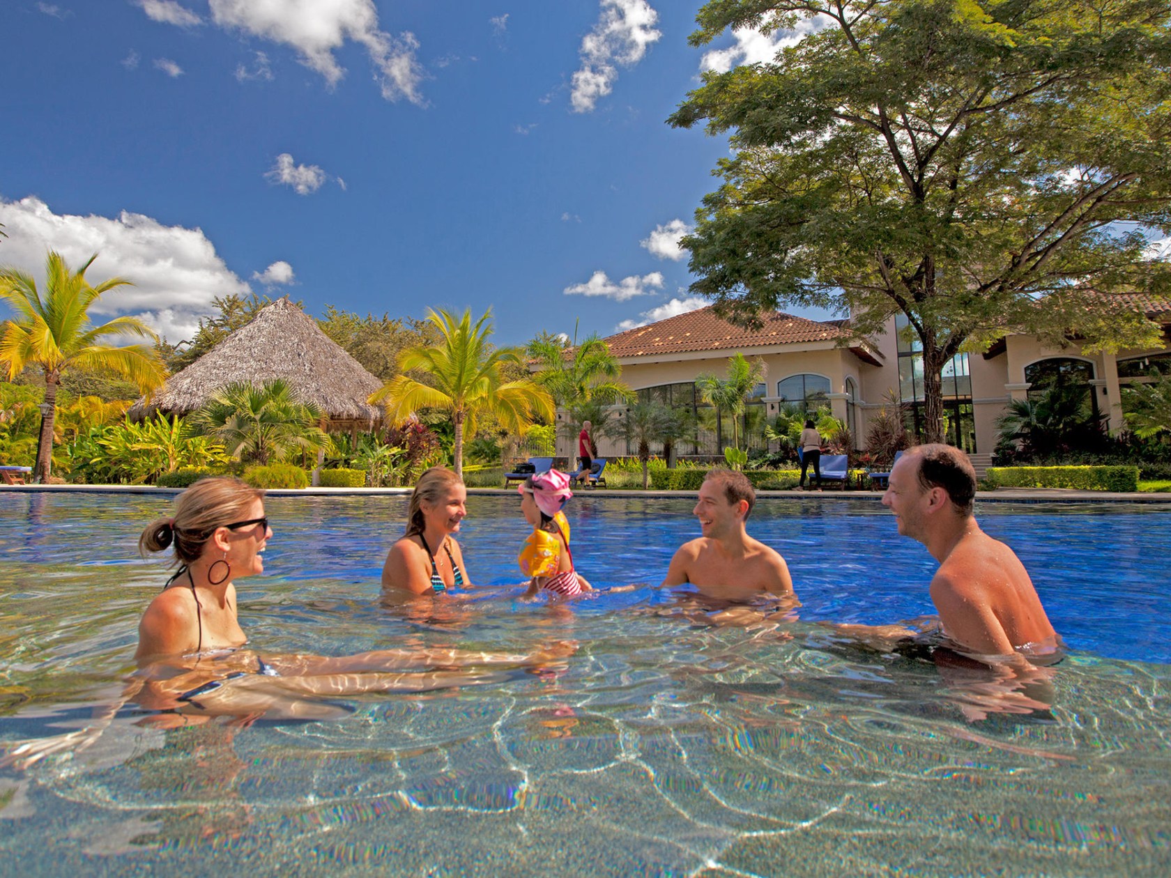 a group of people swimming in a body of water