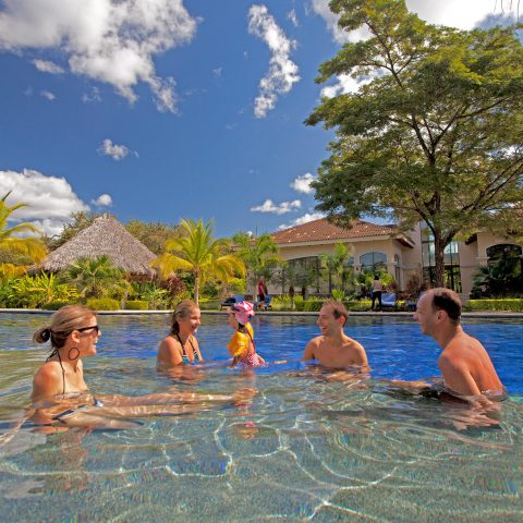 a group of people swimming in a body of water