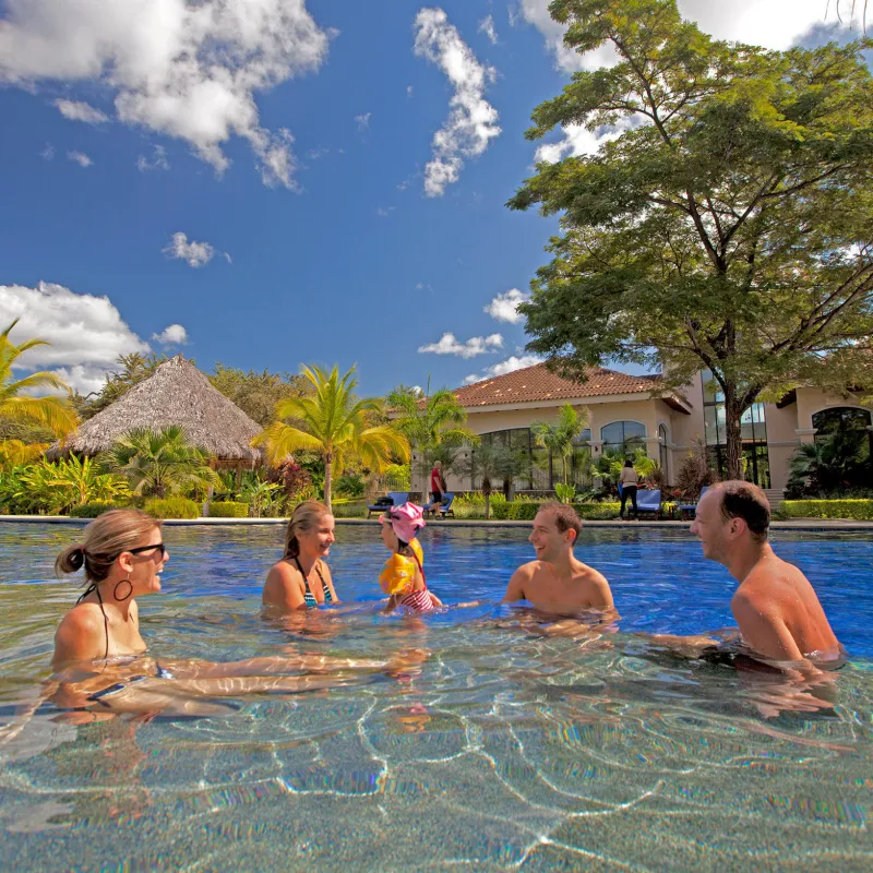 a group of people swimming in a body of water