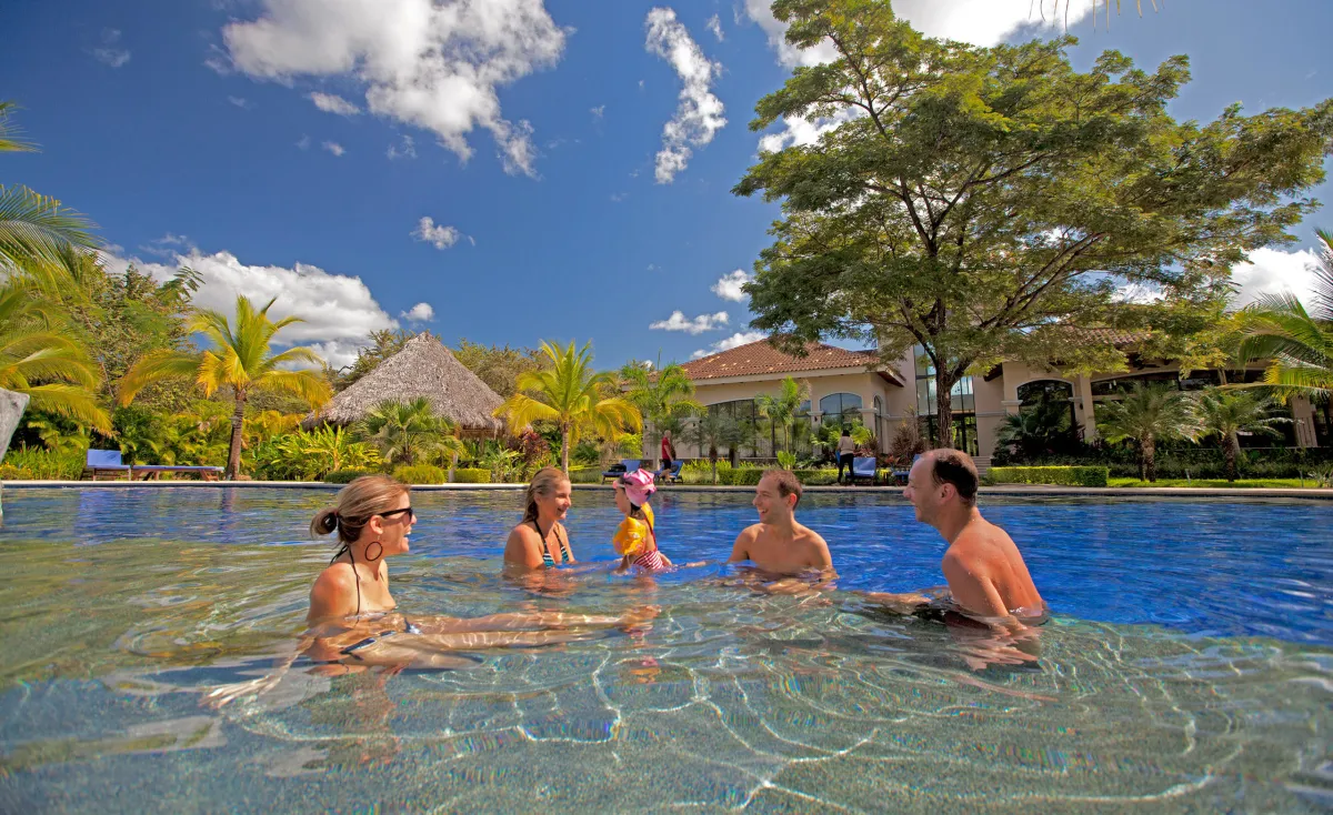 a group of people swimming in a body of water