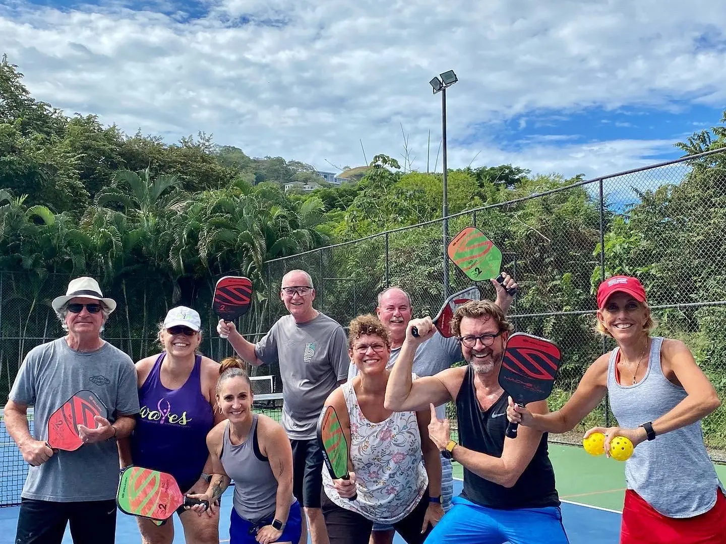Tim Hartley et al. standing in front of a crowd posing for the camera
