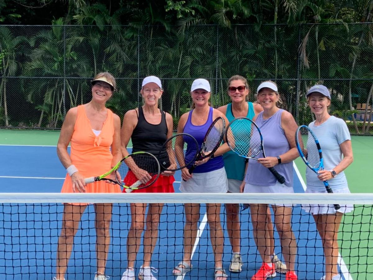 a group of people posing for the net