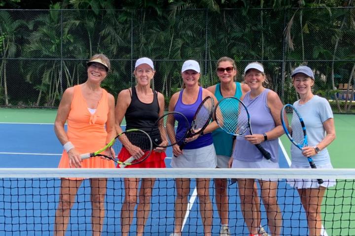 a group of people posing for the net
