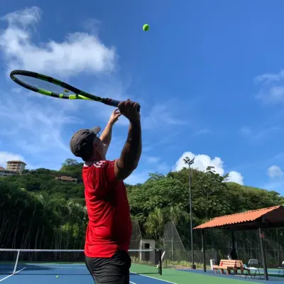 a person hitting a ball with a racket