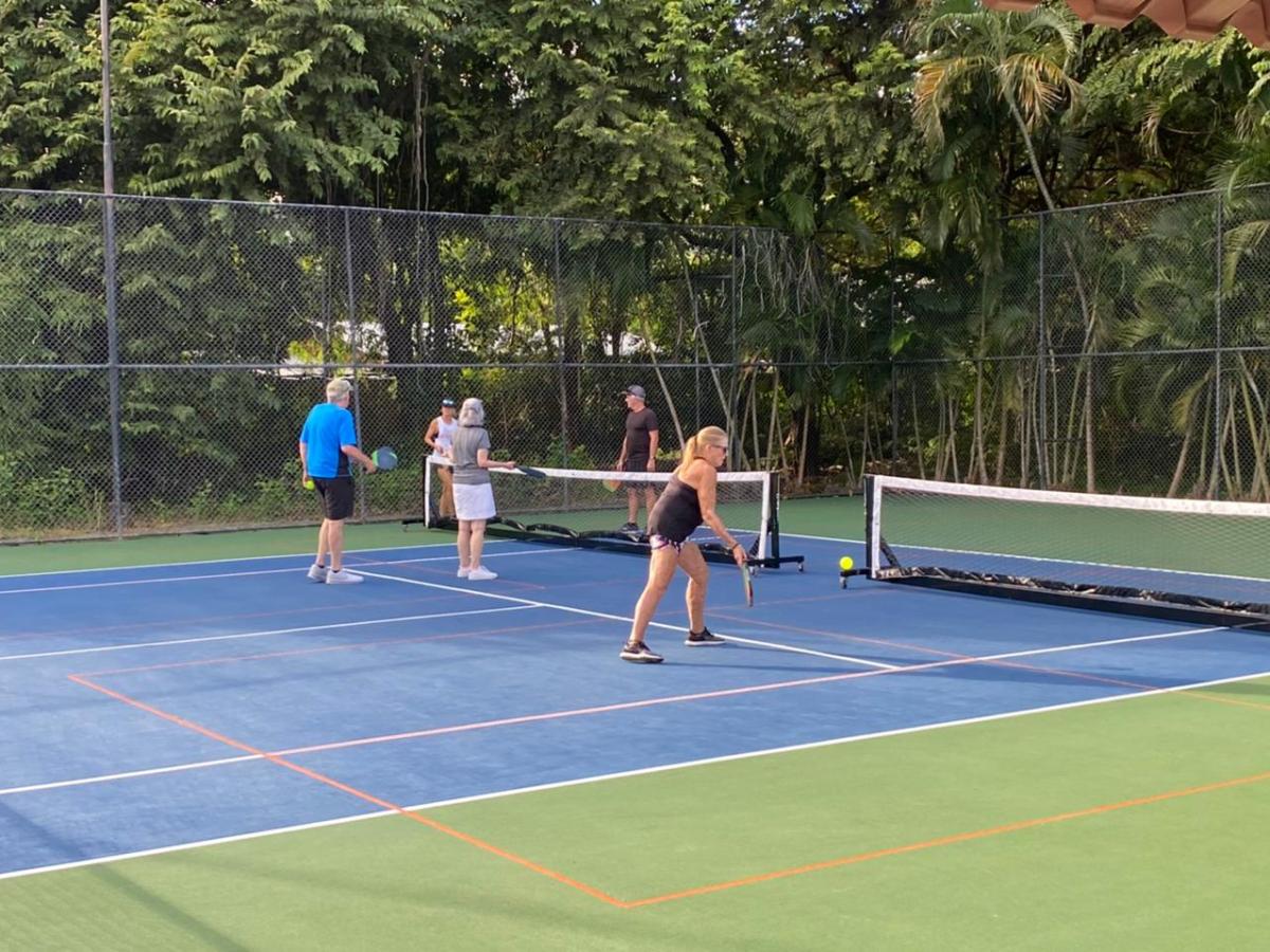 a woman with a racket on a court