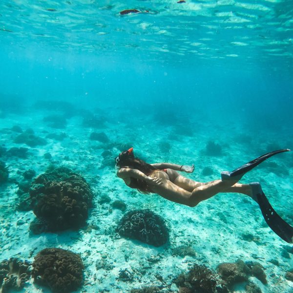 a person swimming in a pool of water