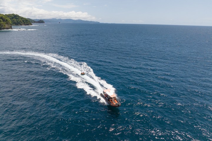 a man riding a wave on top of a body of water