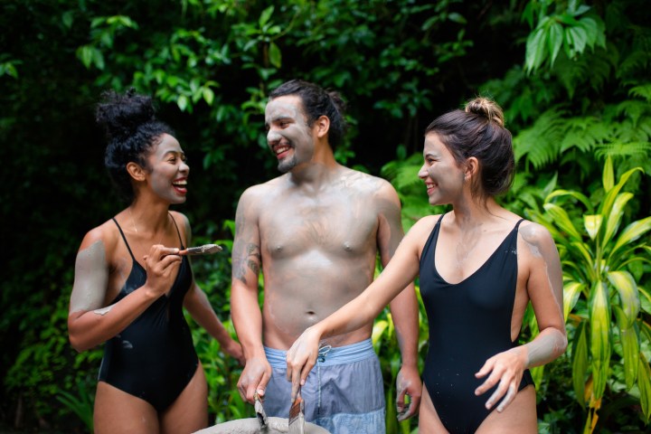 a group of people standing next to a person