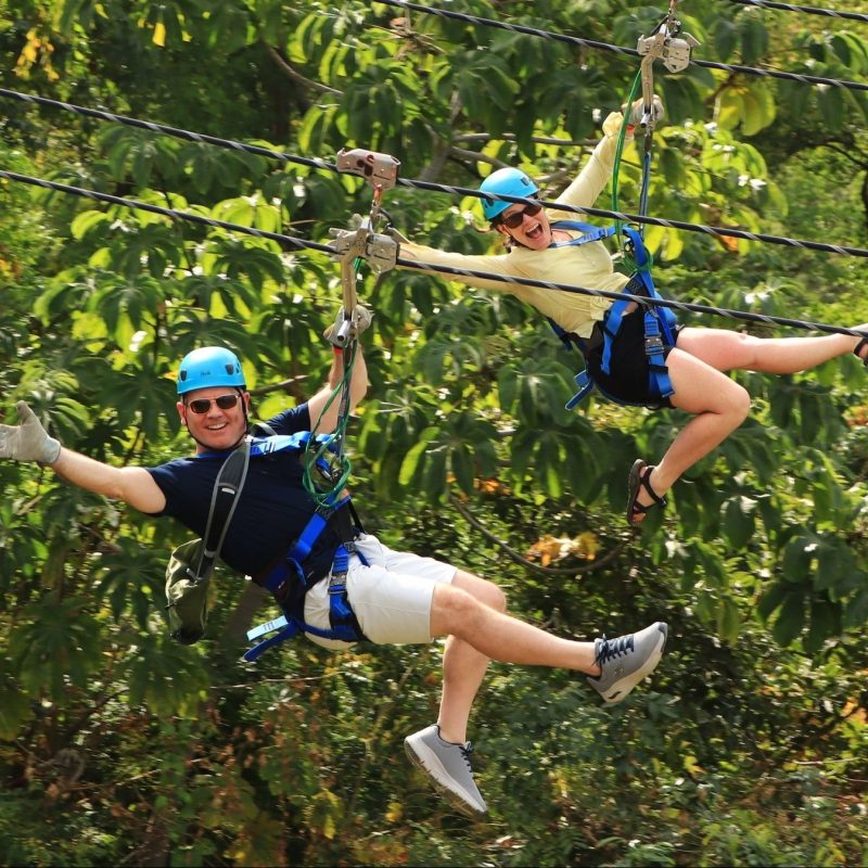a person jumping into the air to catch a frisbee